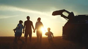 Family at sunset on a summer road trips